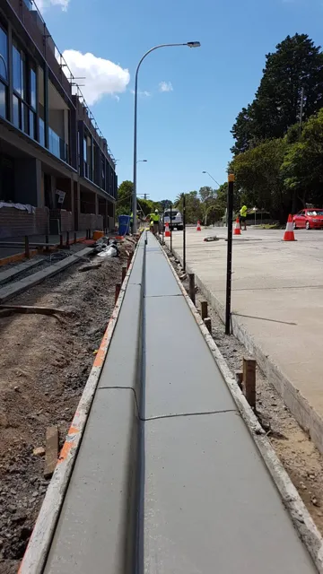 Long run of new kerb and gutter along a residential street